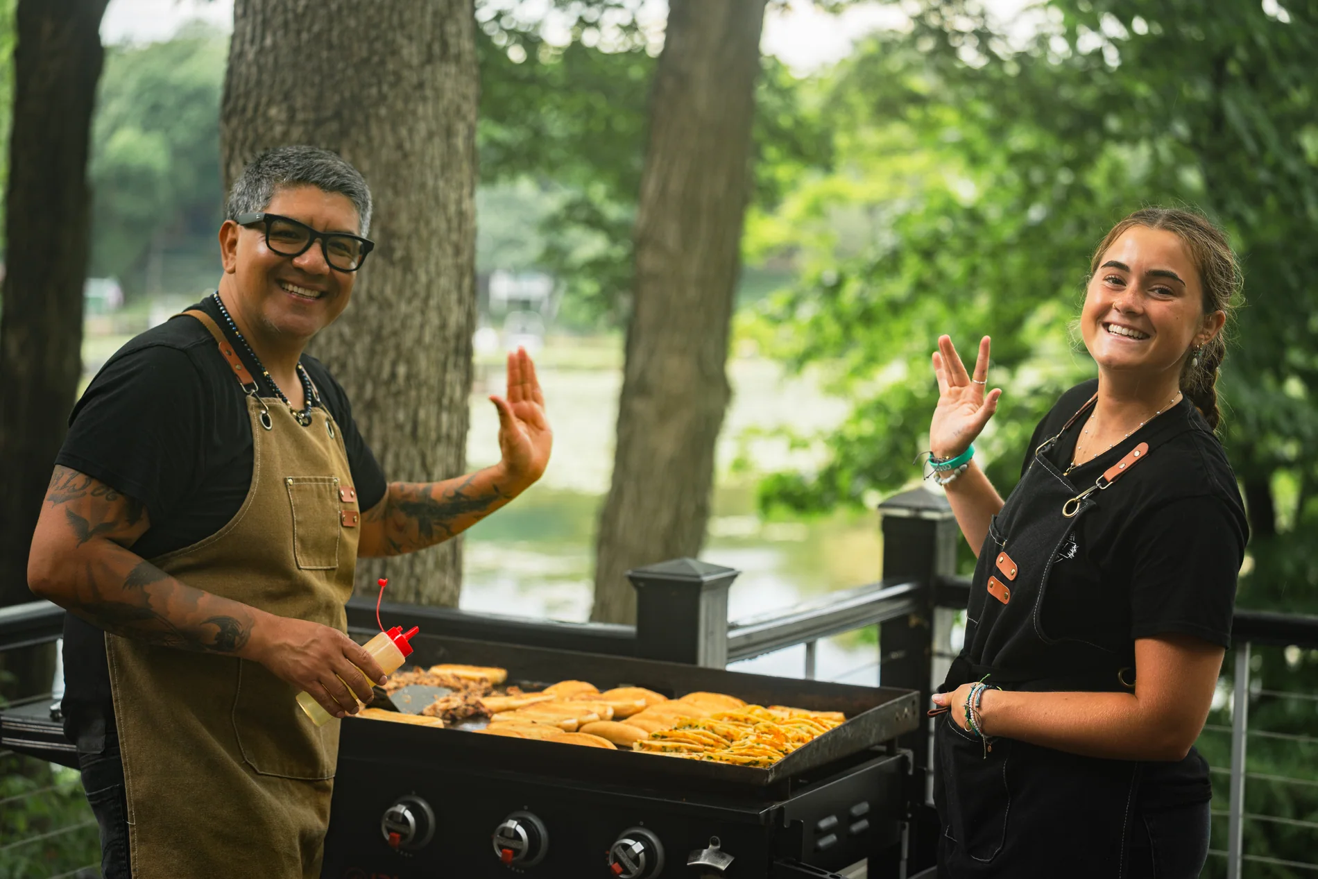 The Madrez! team cooking outdoors at an event